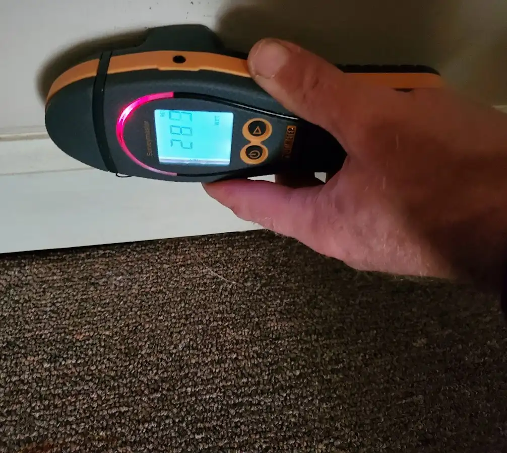 Moisture detection at baseboard during Storm Damage Restoration in Camp Pendleton South